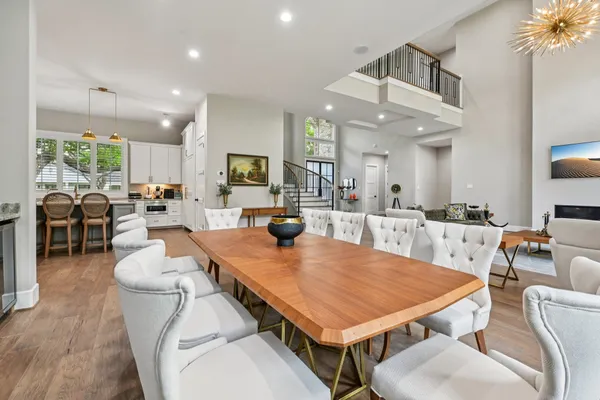 a view of a dining room with furniture and a kitchen
