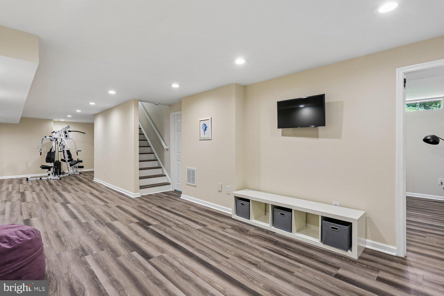 20920 Sunnyacres Road Gaithersburg, MD 20882 - Photo 41 of 64 Lower level rec room with LVP flooring