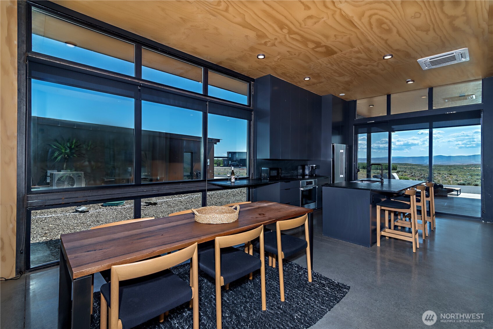 23592 Gorge View Loop Northwest Quincy, WA 98848 - Photo 12 of 24 a dining room with furniture window and wooden floor