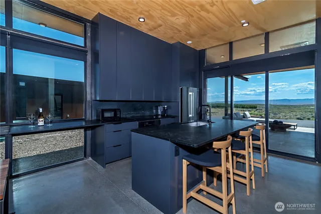 a kitchen with stainless steel appliances granite countertop counter space a sink and cabinets