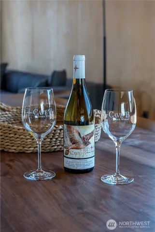 a room with two glass chairs and wooden floor