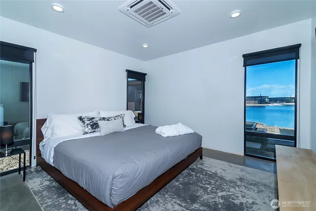 a bedroom with a bed and with furniture