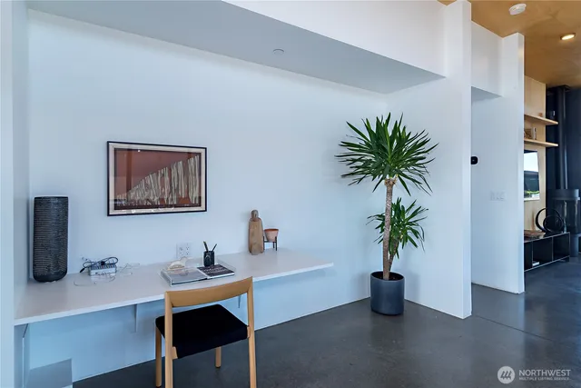 a workspace with furniture and window