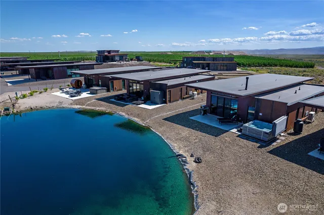 an aerial view of a house with a yard