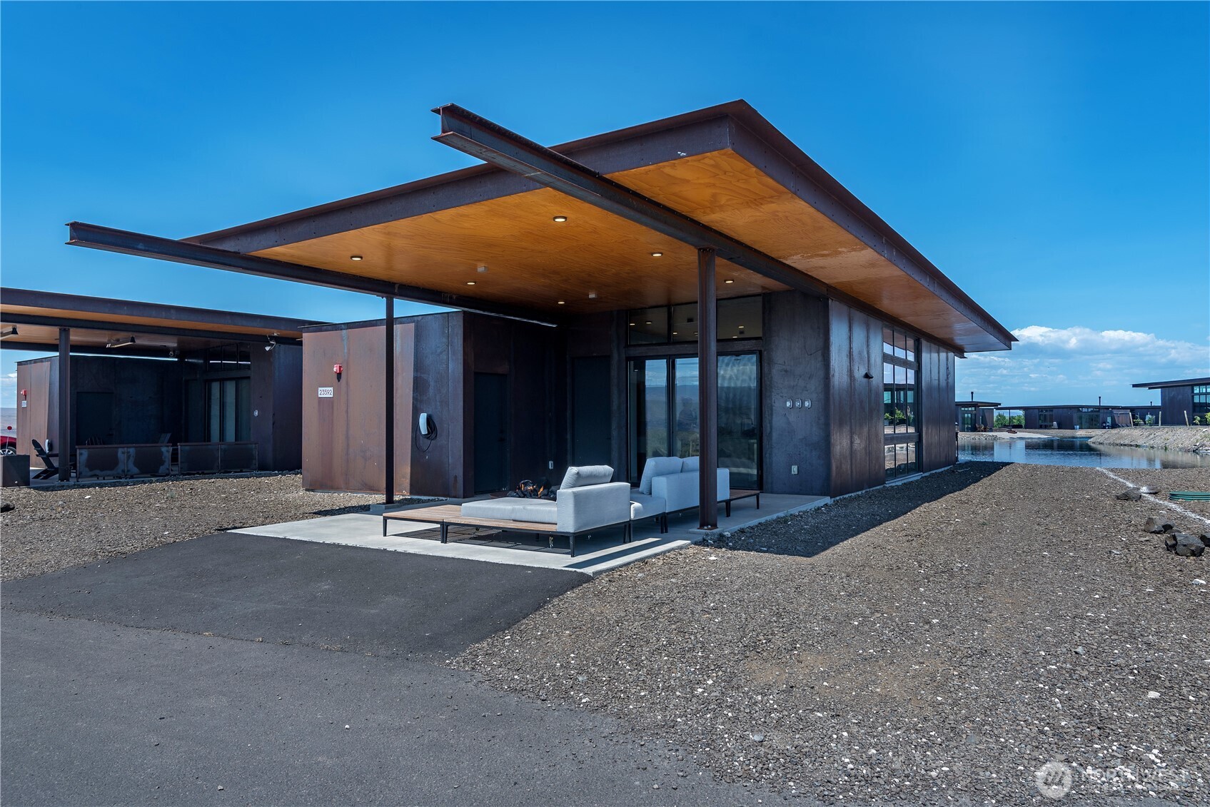 23592 Gorge View Loop Northwest Quincy, WA 98848 - Photo 4 of 24 a backyard of a house with table and chairs