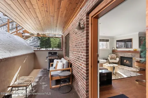 a view of a livingroom with furniture and windows