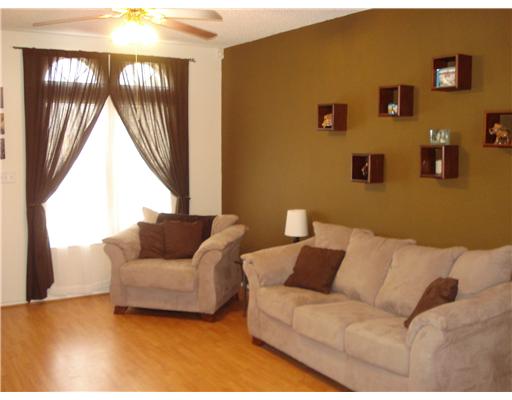 1825 Modesto Street Corpus Christi, TX 78417 - Photo 3 of 4 a living room with furniture and a large window