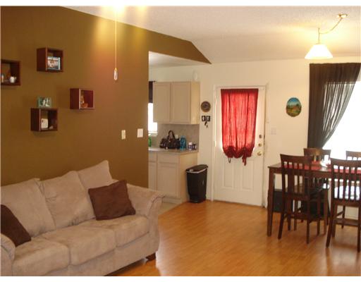 1825 Modesto Street Corpus Christi, TX 78417 - Photo 4 of 4 a living room with furniture a window and a table