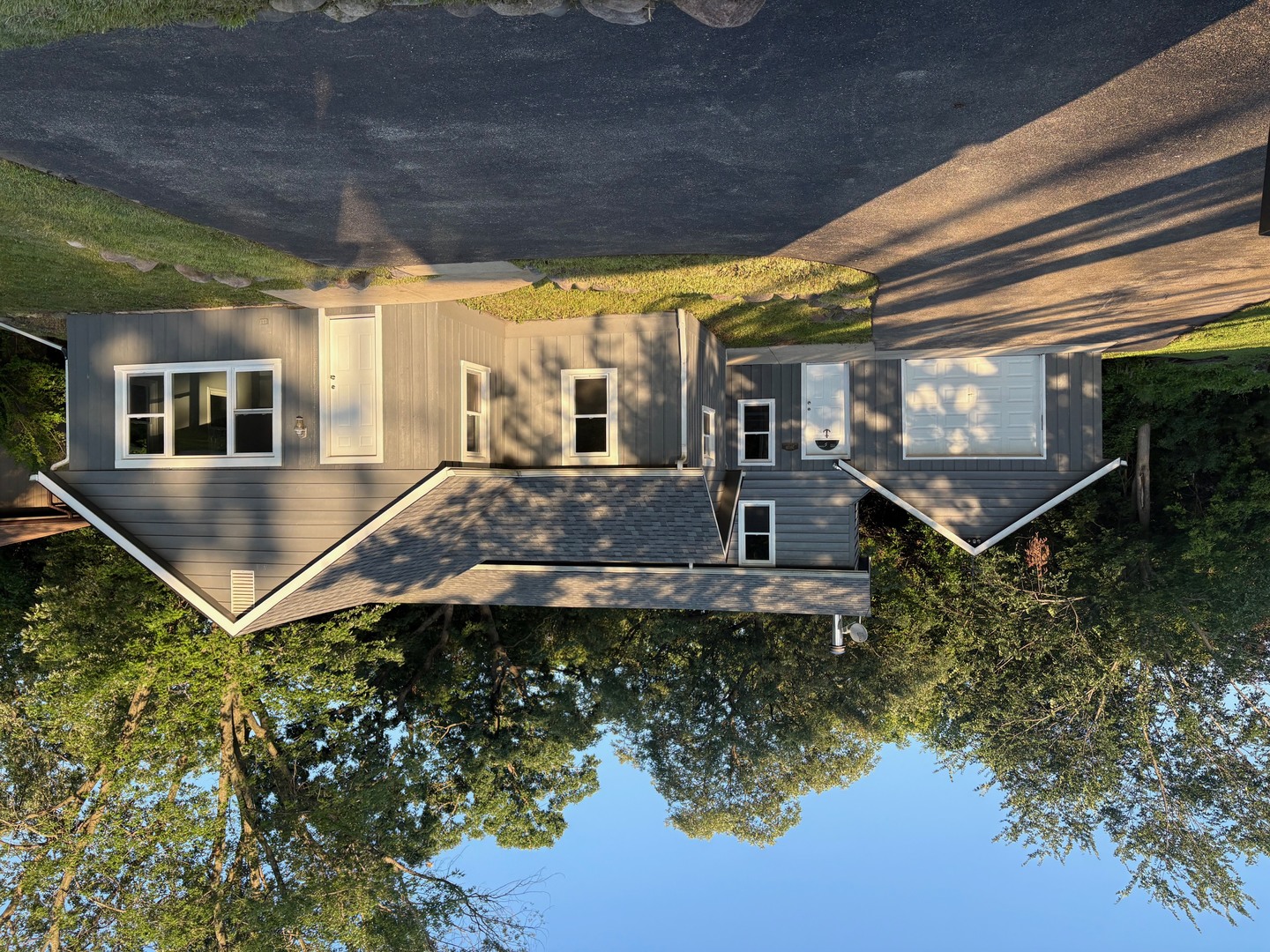 26039 North Gilmer Road Mundelein, IL 60060 - Photo 1 of 19 a front view of a house with garden