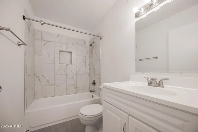 a bathroom with a sink a toilet and a bathtub