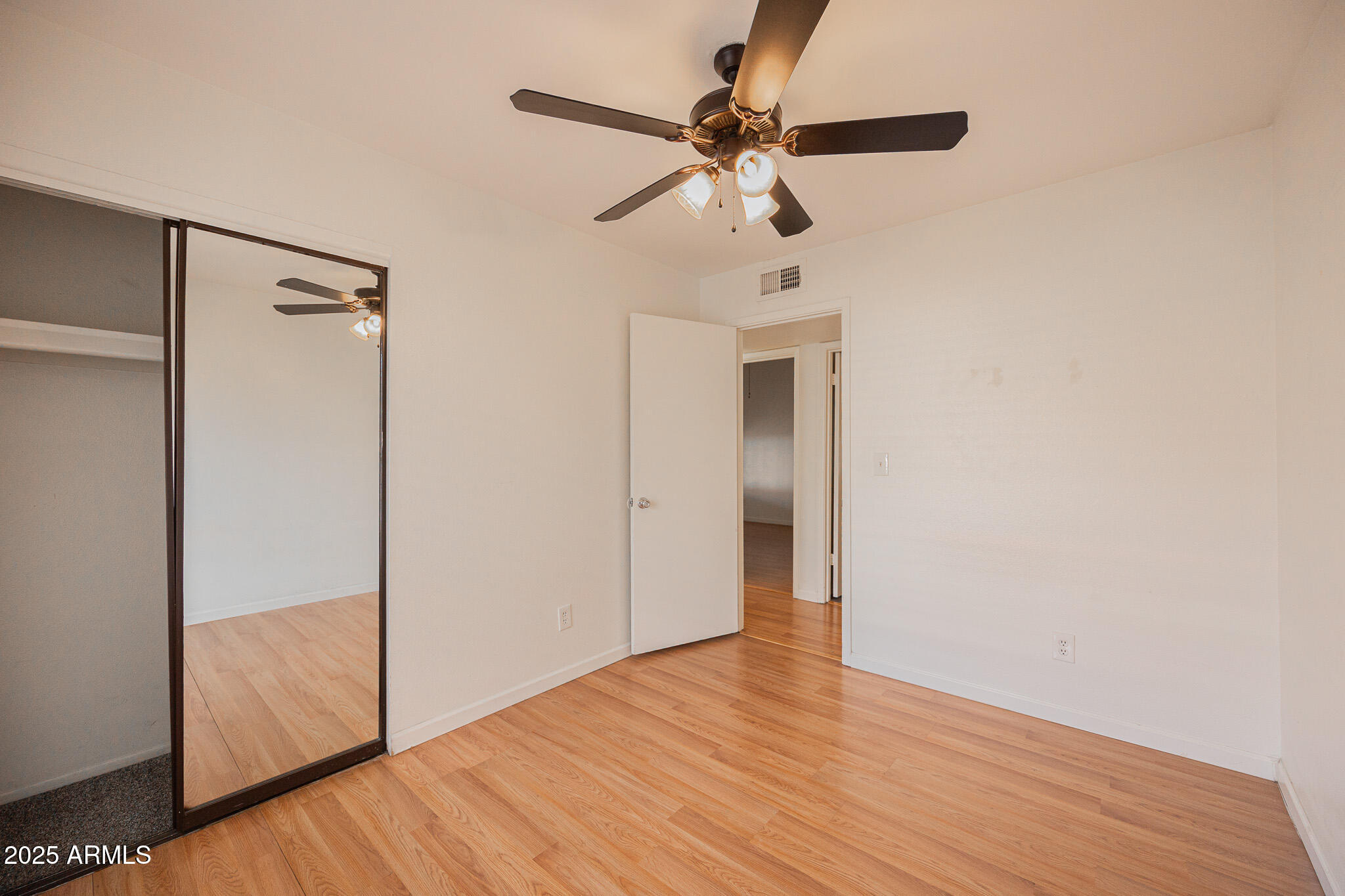 2141 East Kirkland Lane, Unit 4 Tempe, AZ 85281 - Photo 17 of 21 a view of empty room with wooden floor