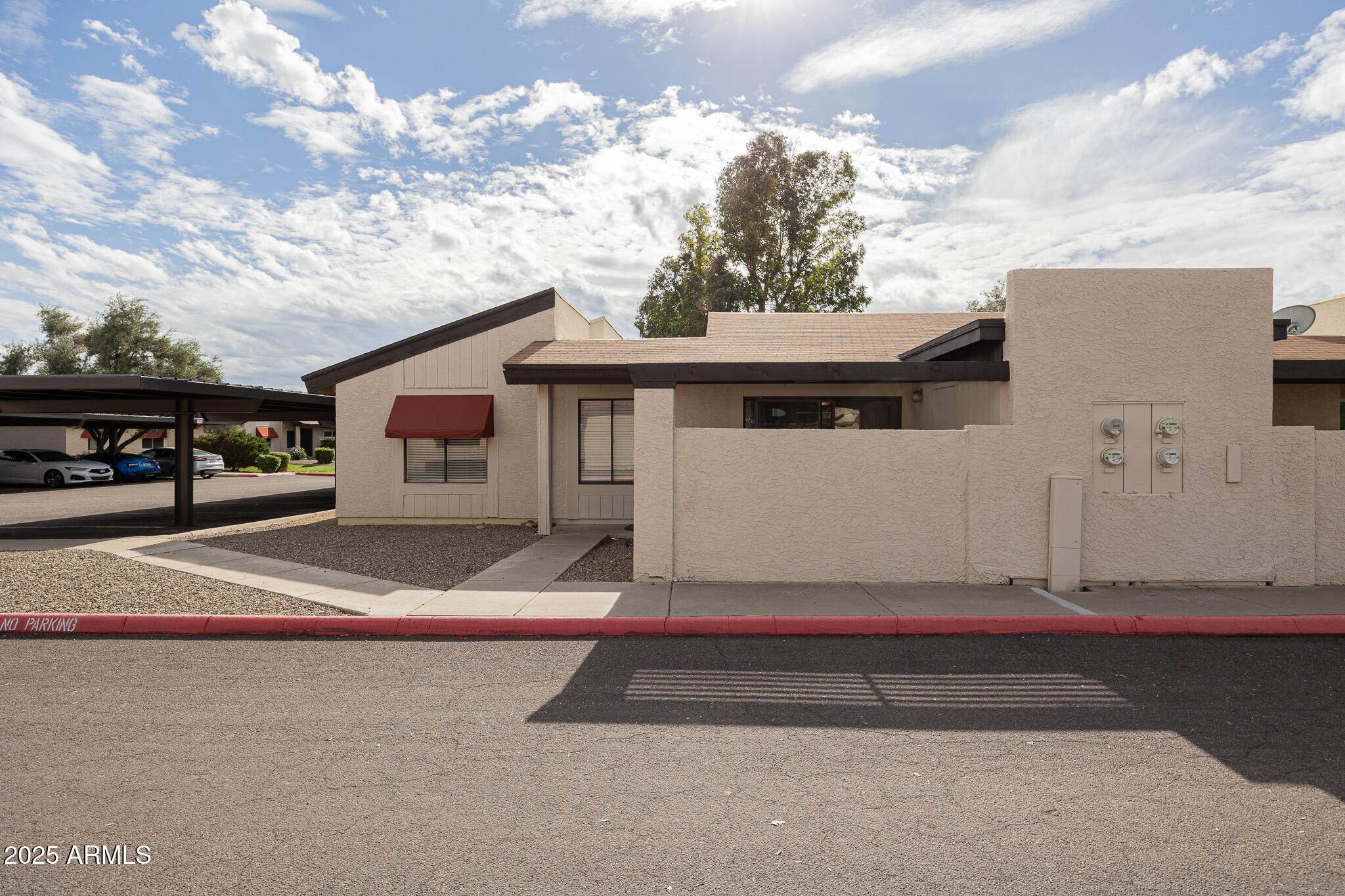 2141 East Kirkland Lane, Unit 4 Tempe, AZ 85281 - Photo 2 of 21 a front view of a house with porch