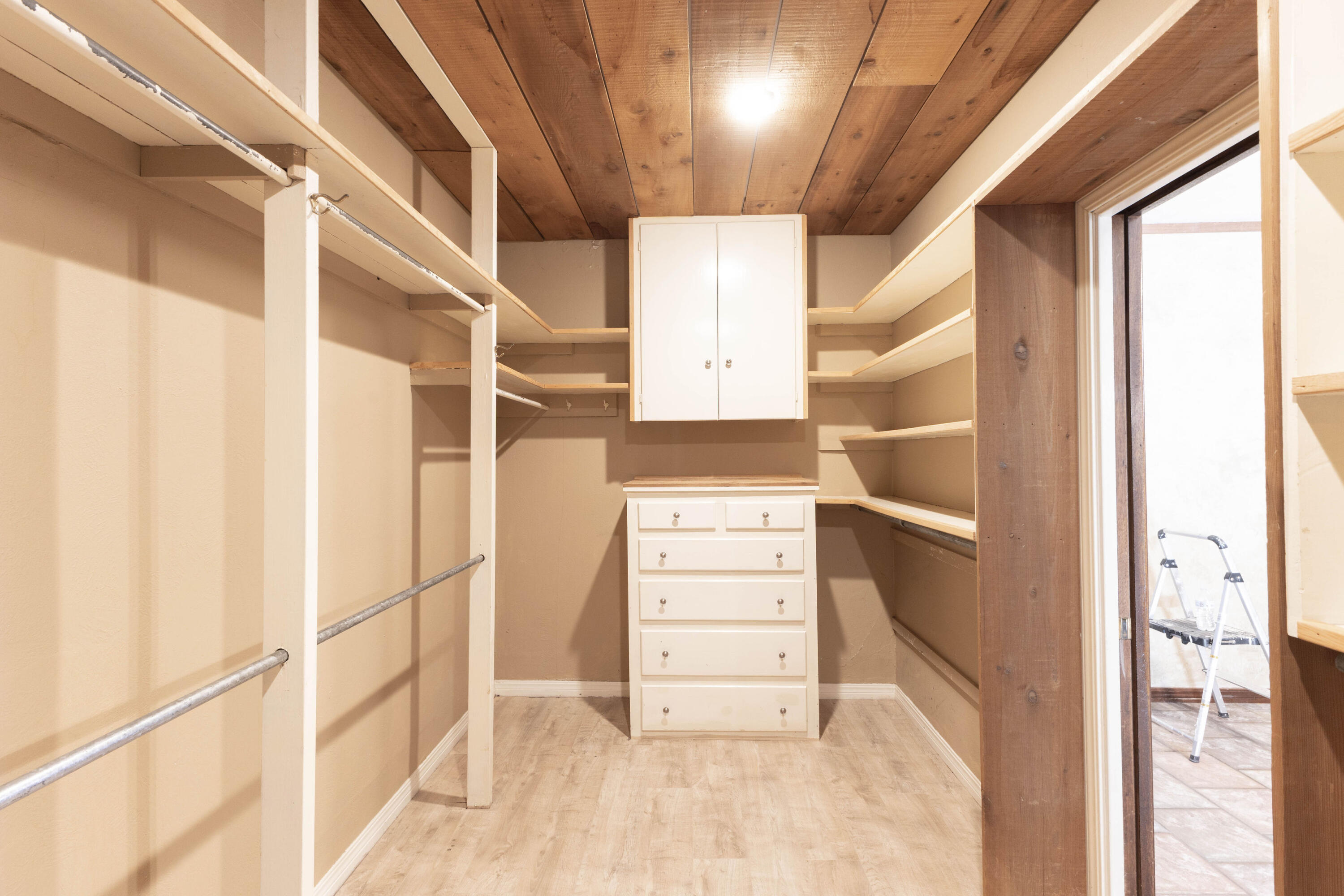 212 West 9th Street Plainview, TX 79072 - Photo 13 of 35 a view of walk in closet with empty racks
