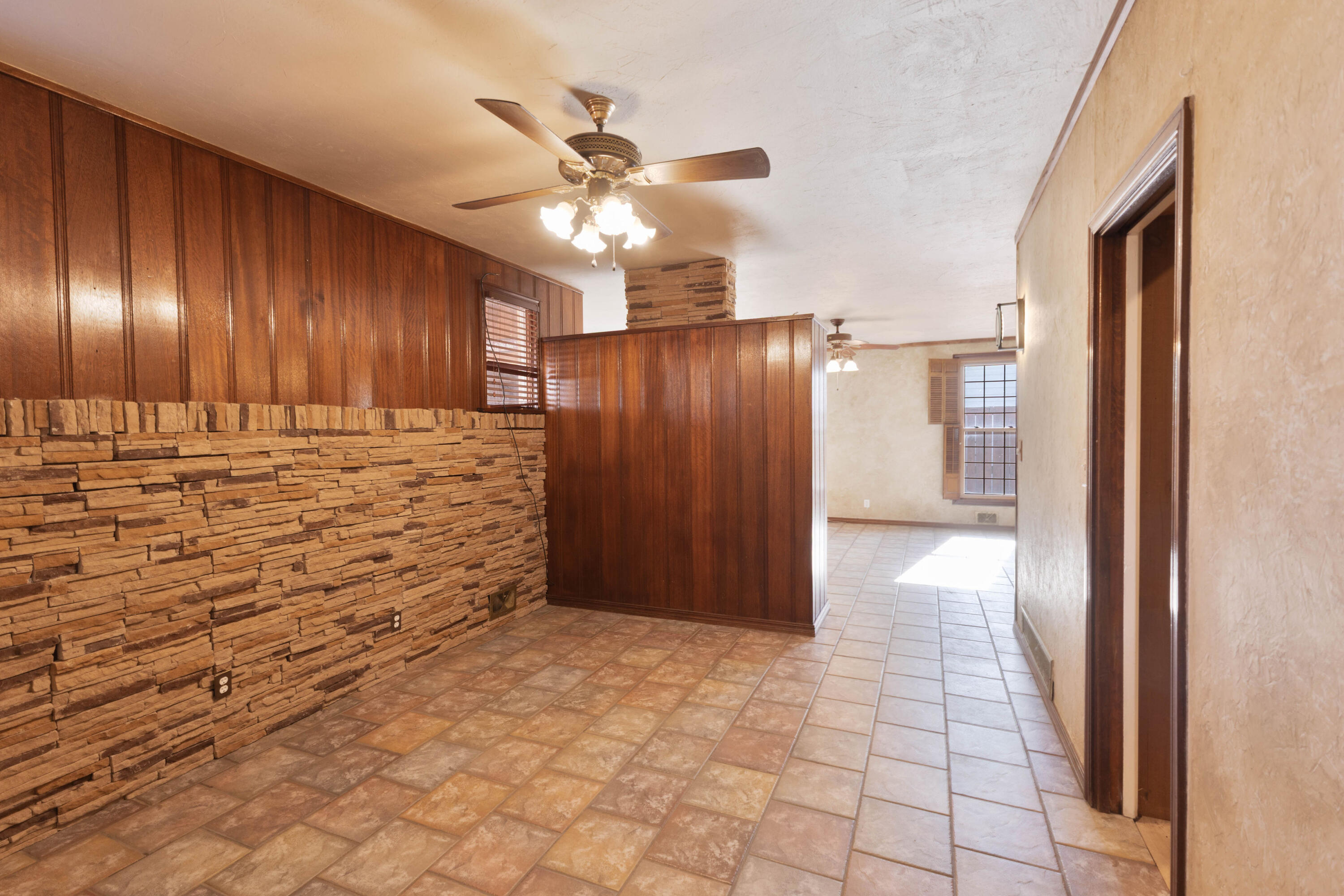 212 West 9th Street Plainview, TX 79072 - Photo 17 of 35 a view of a livingroom with wooden floor and closet area