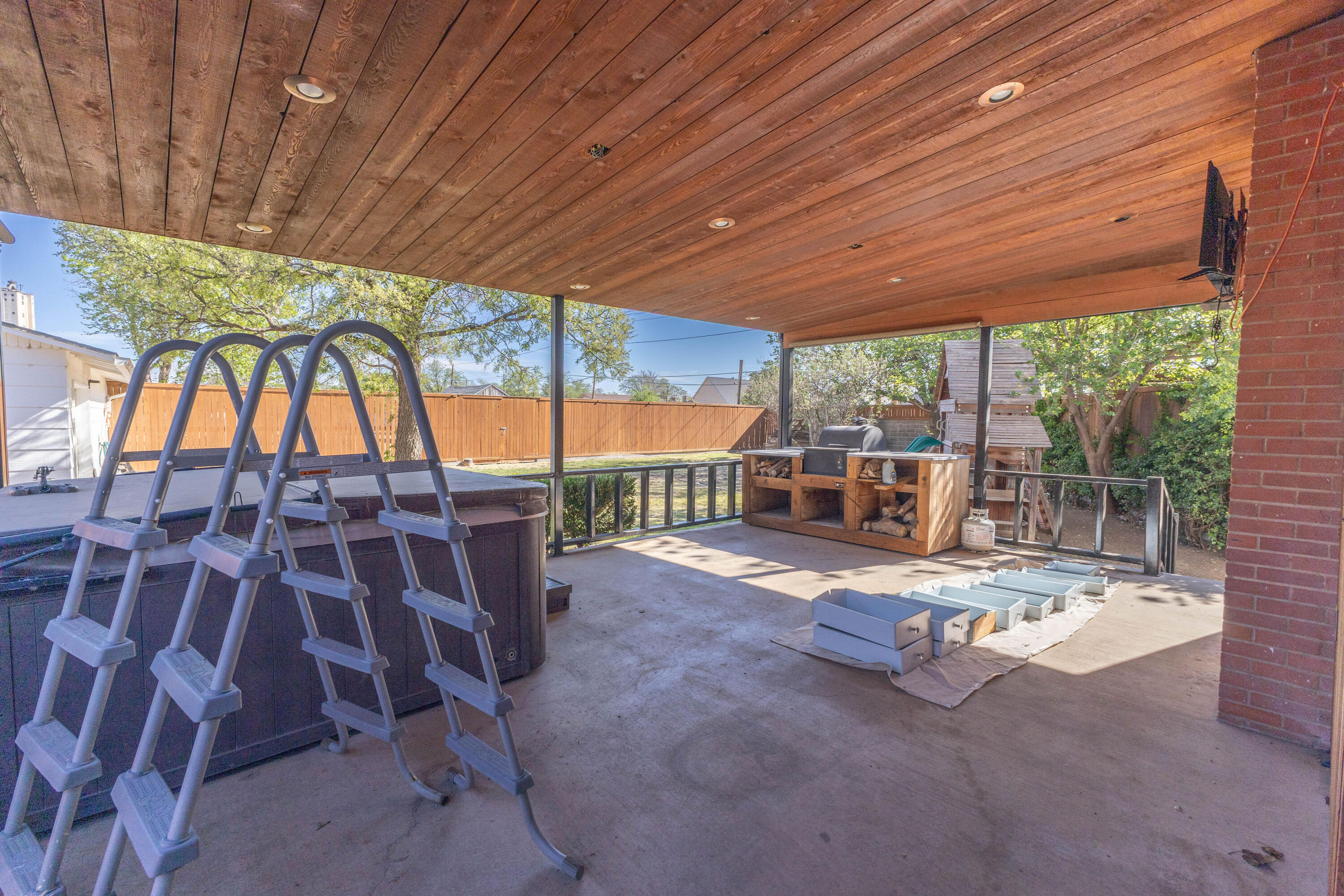212 West 9th Street Plainview, TX 79072 - Photo 33 of 35 a view of swimming pool with outdoor seating