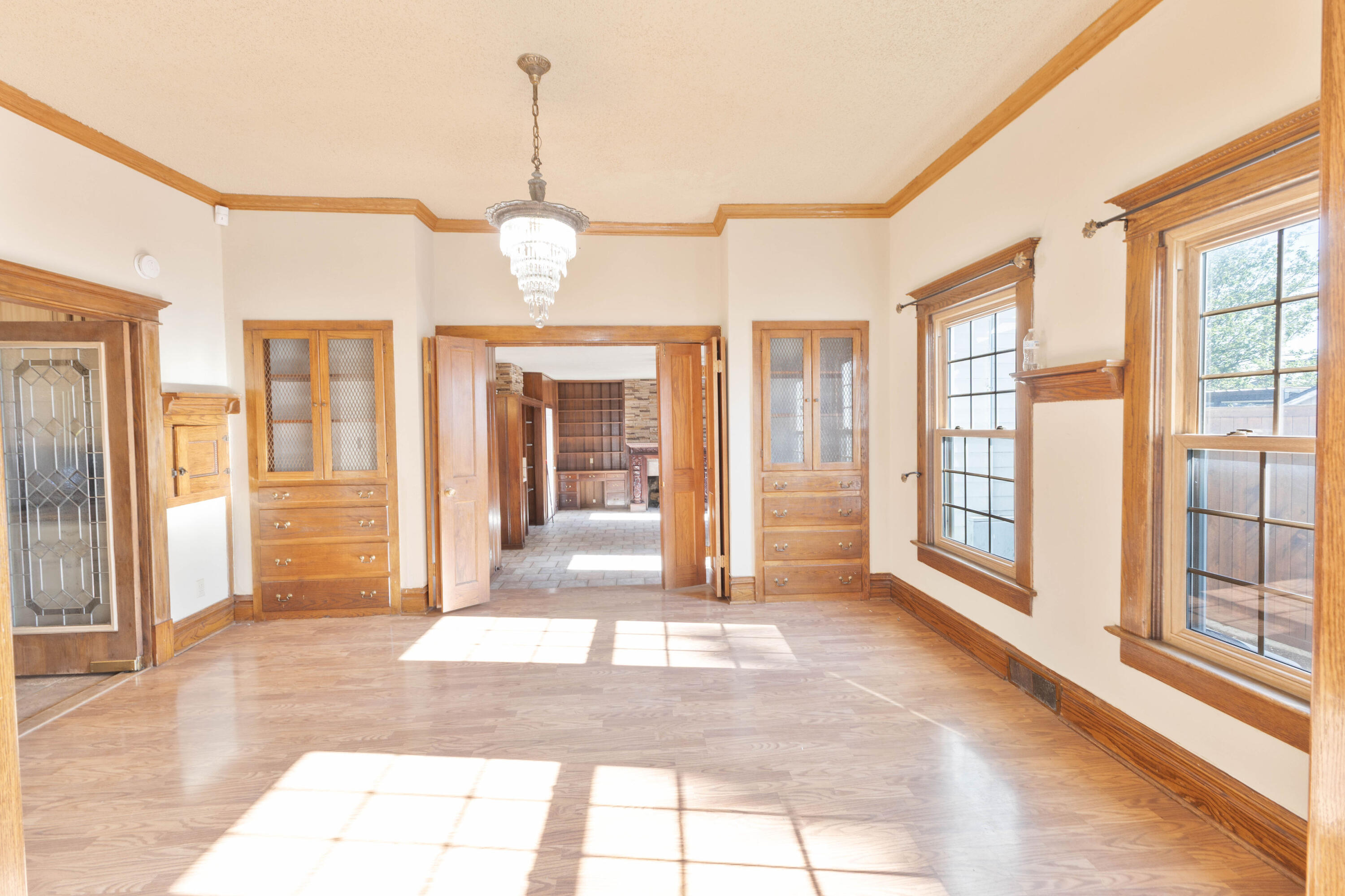 212 West 9th Street Plainview, TX 79072 - Photo 5 of 35 a view of an entryway with wooden floor and door