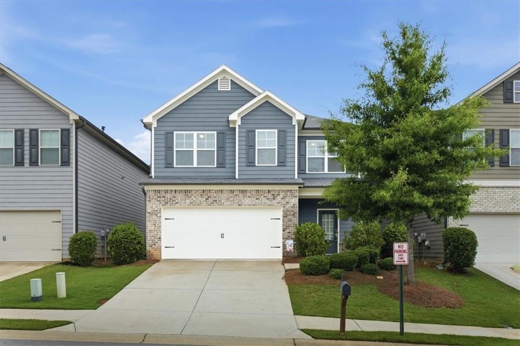 585 Summit Point Canton, GA 30114 - Photo 3 of 30 a front view of a house with a yard