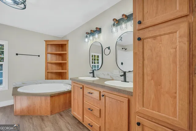 a bathroom with a sink and a mirror