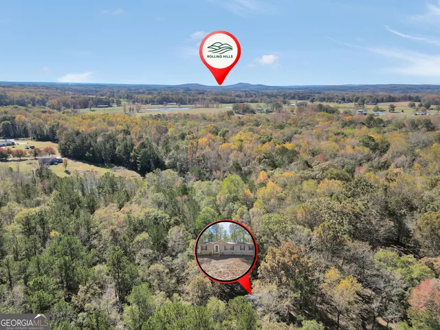 a picture of a room with a white wall and a white refrigerator