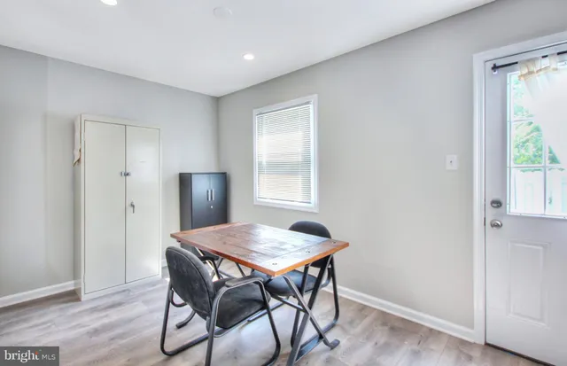 a workspace with furniture and wooden floor