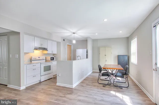 a kitchen with furniture and a stove top oven