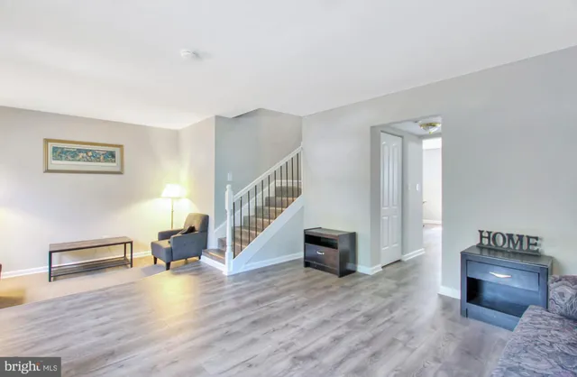 a view of livingroom with furniture and workspace