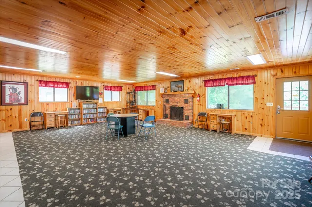 a room with lots of furniture and a window