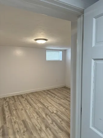 a view of room with wooden floor