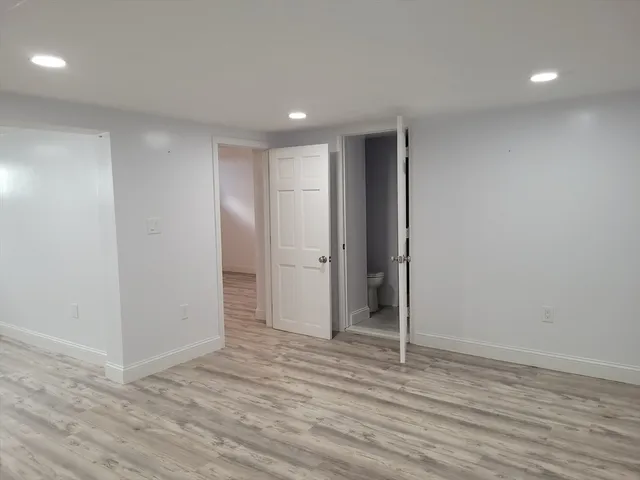 a view of wooden floor and windows in a room