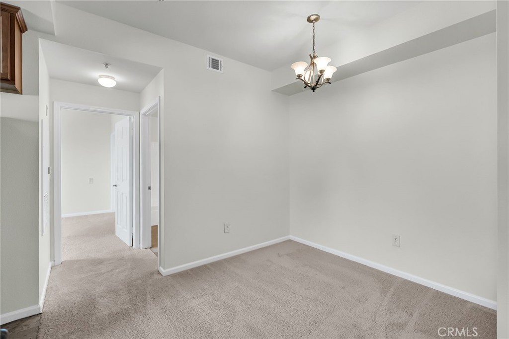 375 Central Avenue, Unit 83 Riverside, CA 92507 - Photo 13 of 29 a view of an empty room with a window