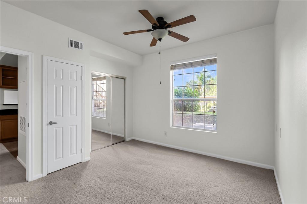 375 Central Avenue, Unit 83 Riverside, CA 92507 - Photo 17 of 29 a view of an empty room with a window