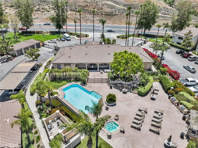 an aerial view of a house with a yard and lake view