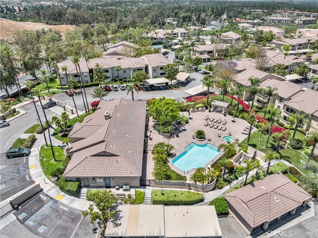 an aerial view of residential houses with outdoor space
