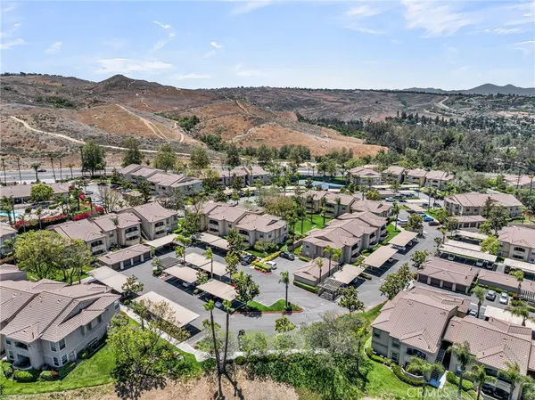 an aerial view of residential houses with outdoor space