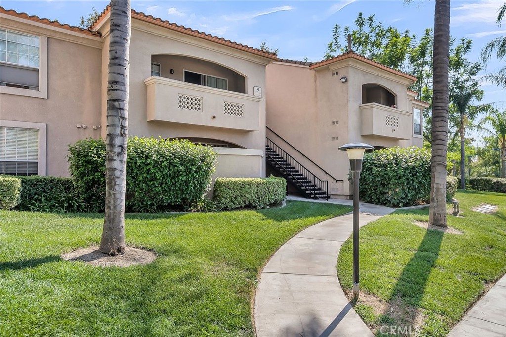 375 Central Avenue, Unit 83 Riverside, CA 92507 - Photo 28 of 29 a front view of a house with a yard