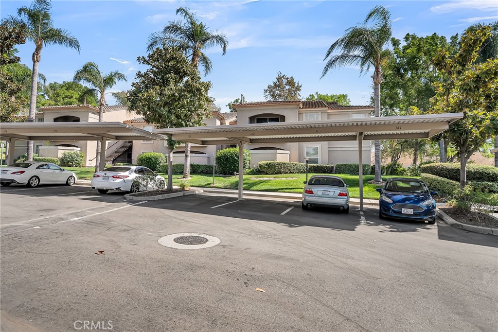 375 Central Avenue, Unit 83 Riverside, CA 92507 - Photo 29 of 29 a car parked in front of a house