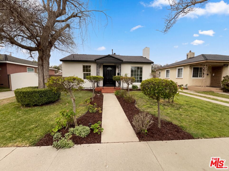 3237 Daisy Avenue Long Beach, CA 90806 - Photo 1 of 28 a front view of a house with garden