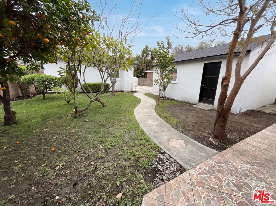 3237 Daisy Avenue Long Beach, CA 90806 - Photo 17 of 28 a view of a backyard with plants and a patio