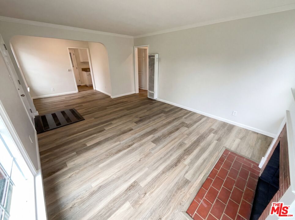 3237 Daisy Avenue Long Beach, CA 90806 - Photo 19 of 28 a view of an empty room and wooden floor