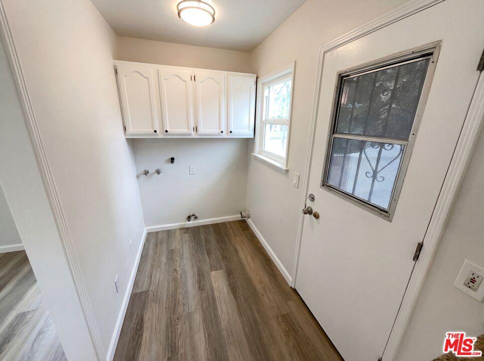 3237 Daisy Avenue Long Beach, CA 90806 - Photo 21 of 28 a view of a hallway and wooden floor