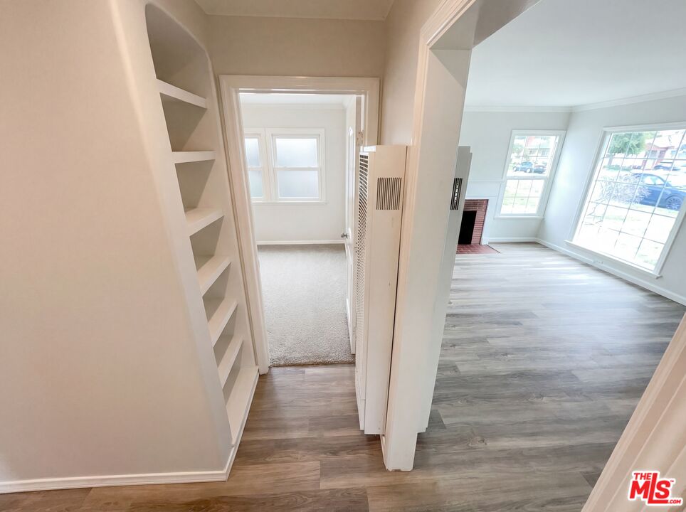 3237 Daisy Avenue Long Beach, CA 90806 - Photo 22 of 28 a view of a hallway with wooden floor and windows