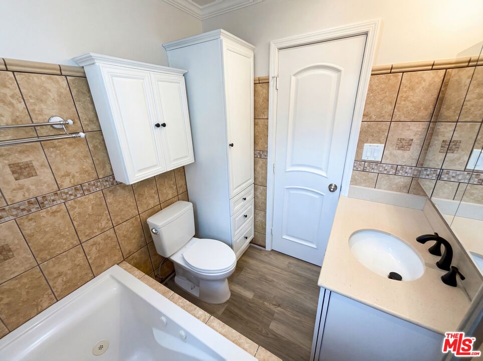 3237 Daisy Avenue Long Beach, CA 90806 - Photo 27 of 28 a bathroom with a sink and a mirror