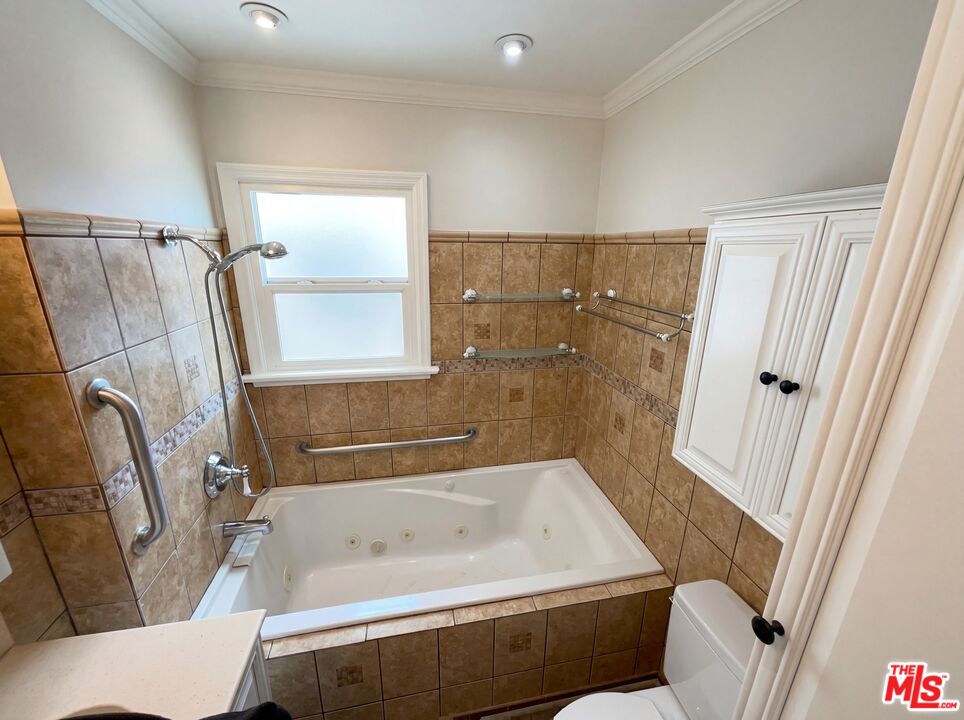 3237 Daisy Avenue Long Beach, CA 90806 - Photo 6 of 28 a bathroom with a tub a sink and a shower