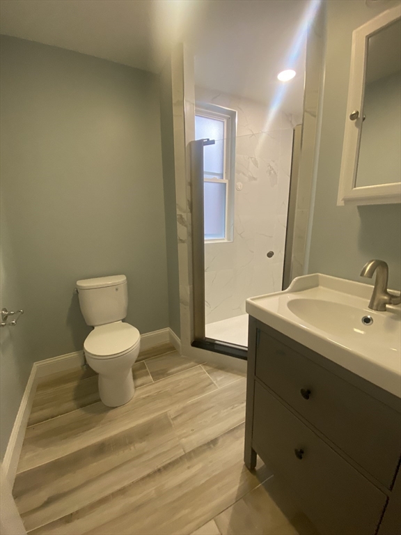 186 Kelton Street, Unit 2 Boston, MA 02134 - Photo 11 of 11 a bathroom with a sink and a mirror