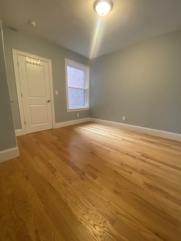 186 Kelton Street, Unit 2 Boston, MA 02134 - Photo 6 of 11 a view of an empty room and window