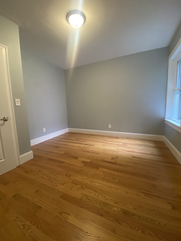 186 Kelton Street, Unit 2 Boston, MA 02134 - Photo 7 of 11 a view of room and wooden floor
