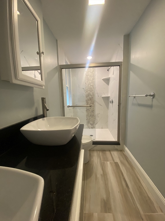 186 Kelton Street, Unit 2 Boston, MA 02134 - Photo 10 of 11 a bathroom with a sink and a mirror