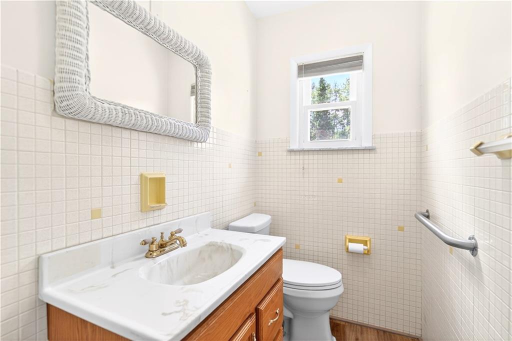 607 Cemetery Road Perryopolis, PA 15473 - Photo 11 of 30 a bathroom with a sink toilet and mirror