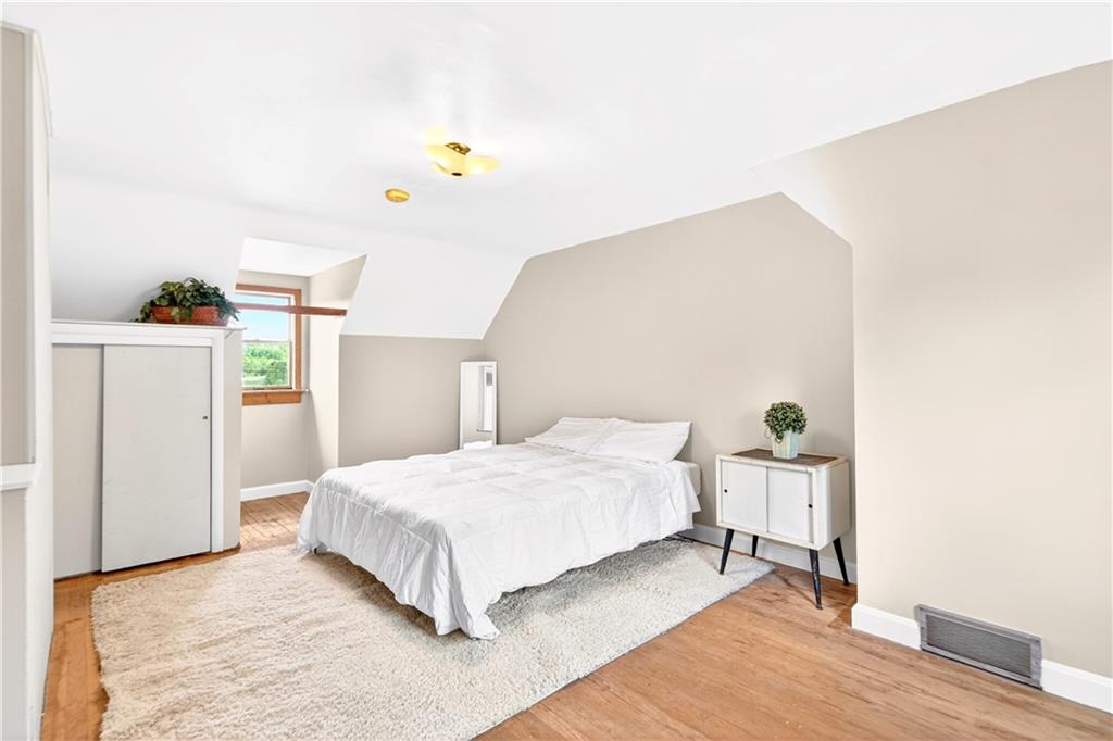 607 Cemetery Road Perryopolis, PA 15473 - Photo 13 of 30 a bedroom with a bed and a dresser