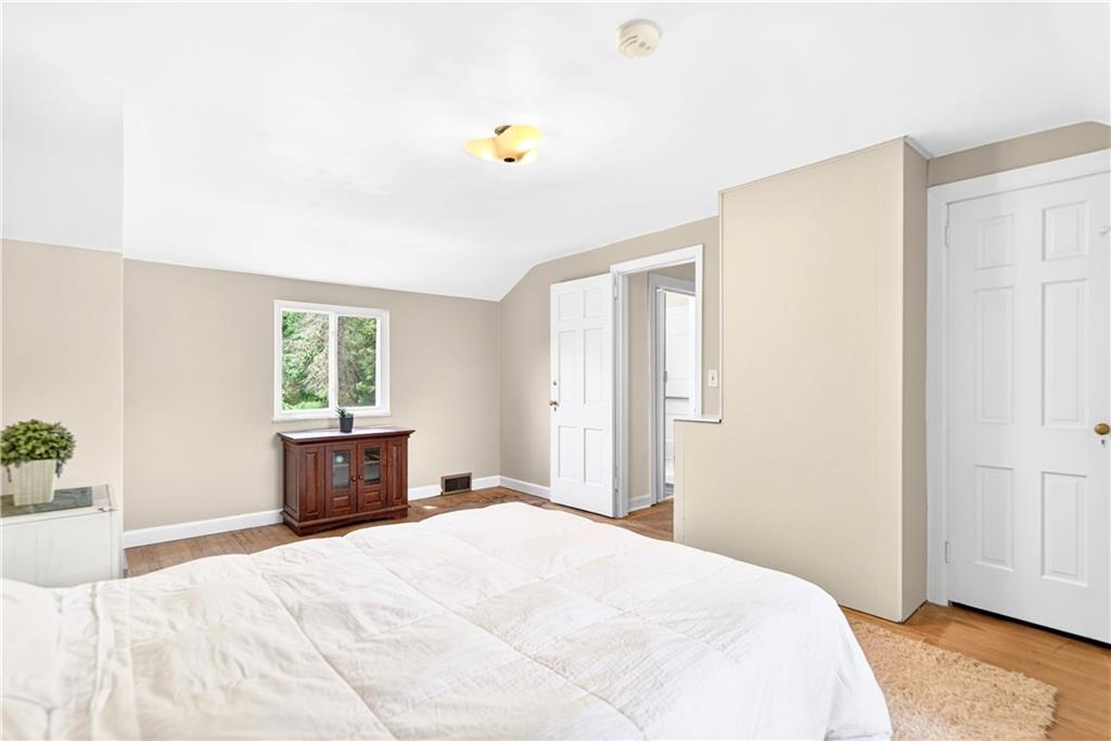 607 Cemetery Road Perryopolis, PA 15473 - Photo 14 of 30 a bedroom with a bed and a window